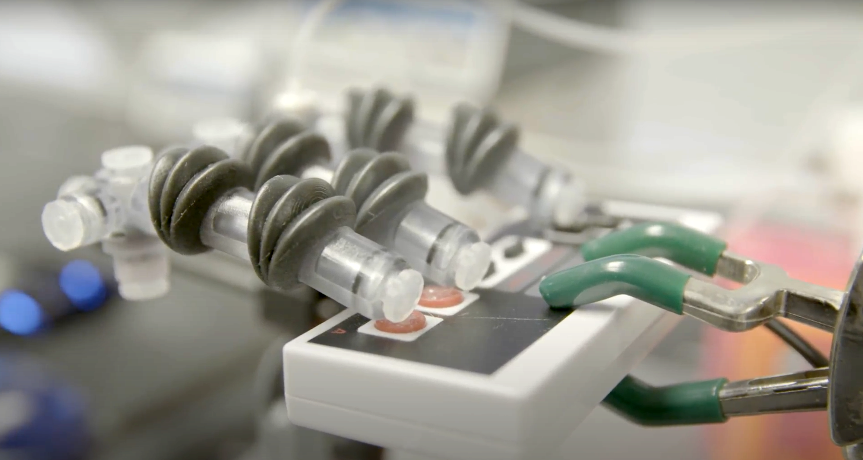 A photo of a 3D printed robotic hand on an old gaming controller.